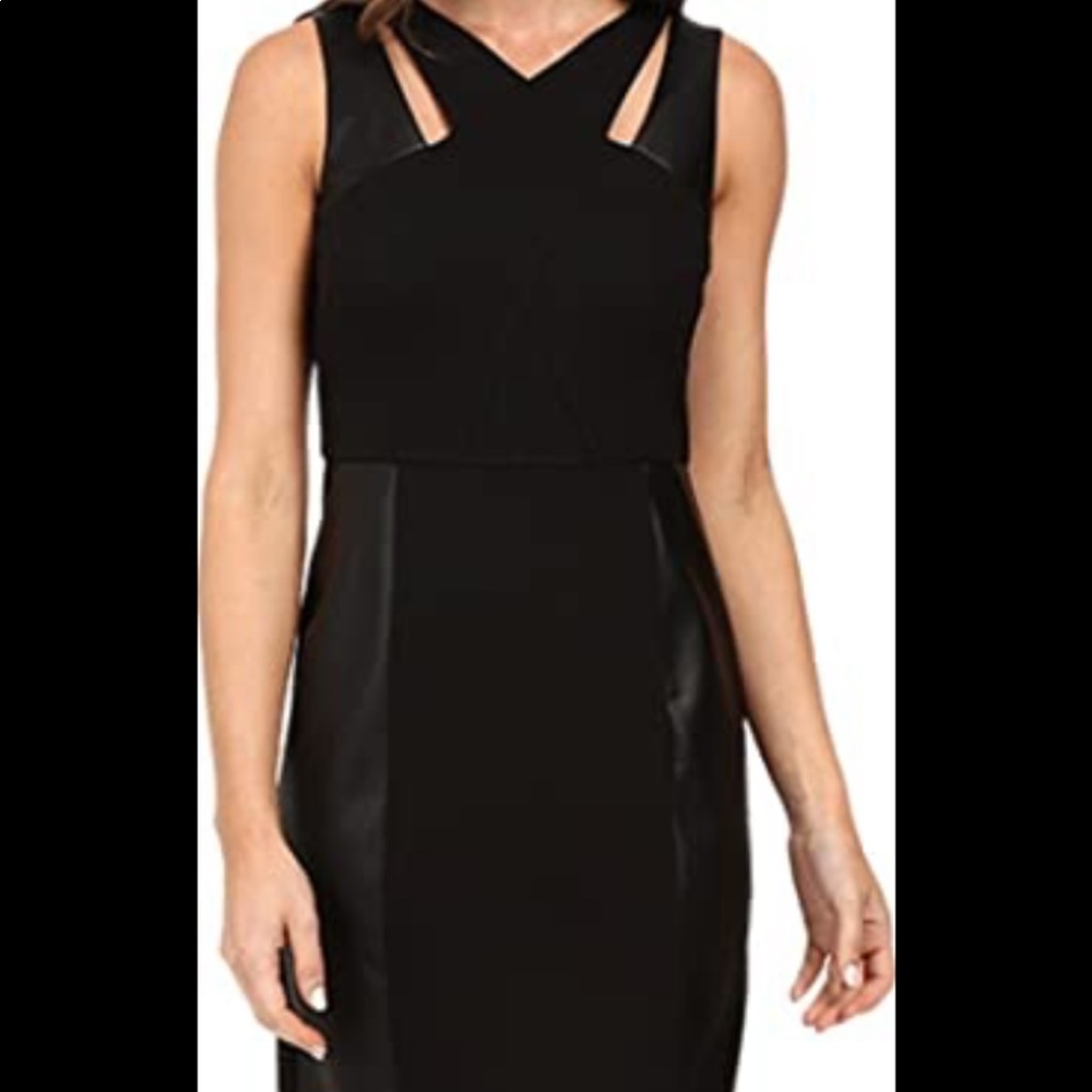 Cut out dress with leather, by laundry. NWT